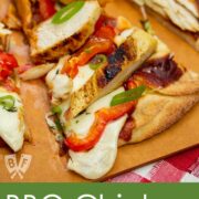 Overhead view of BBQ Chicken Pizza with Smoked Mozzarella on a pizza peel.