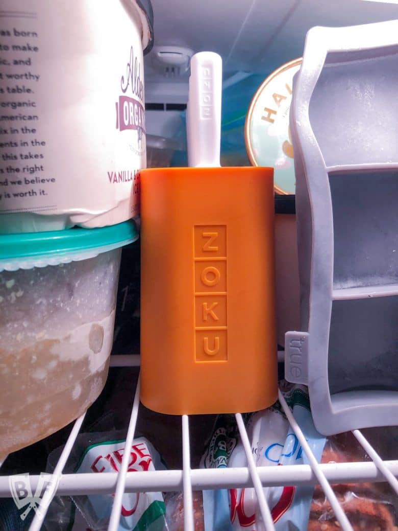 Popsicle mold full of Black Forest Popsicles nestled in the freezer.