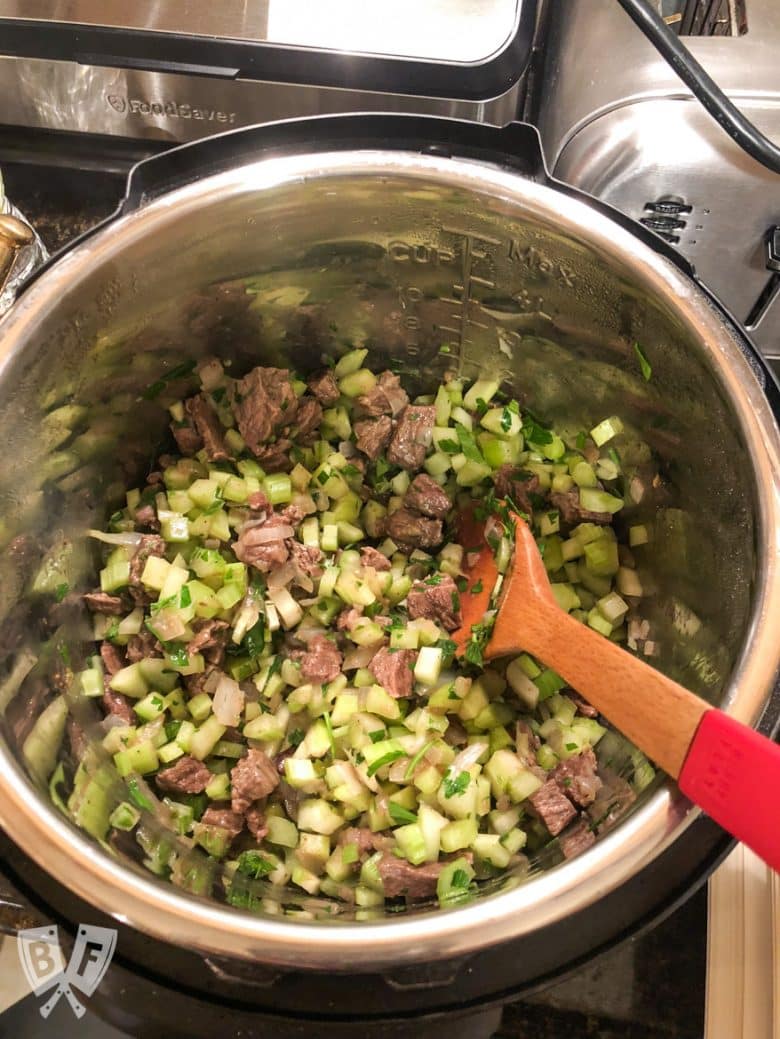 Overhead view of ingredients in the Instant Pot for Persian Beef and Celery Stew (Khoreshe Karafs).