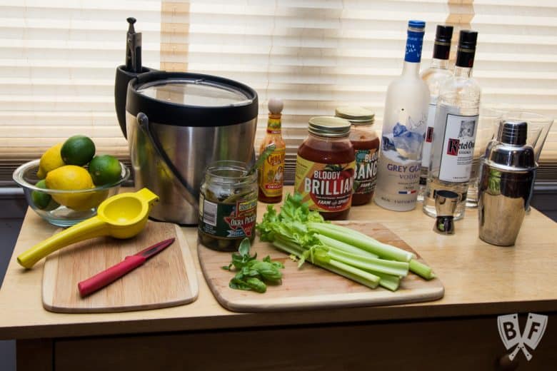 Front view of a bloody mary bar with garnishes.