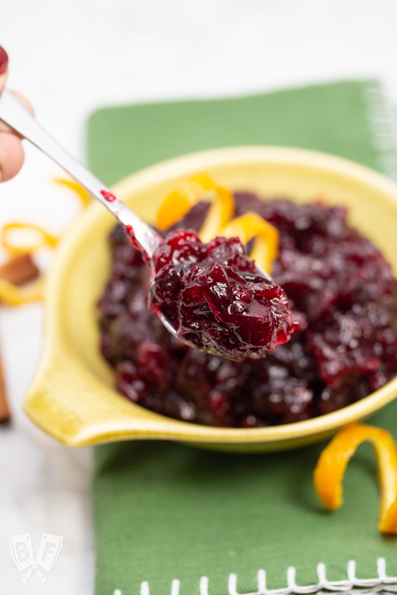 Close up of a spoon of Instant Pot Spiced Cranberry Sauce with Bourbon