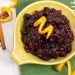 Overhead view of a bowl of Instant Pot Spiced Cranberry Sauce with Bourbon with whole spices.