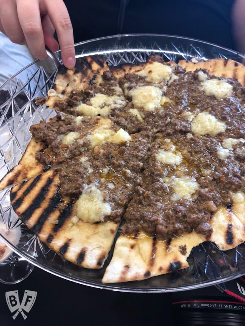 Close-up view of a beef bolognese pizza.