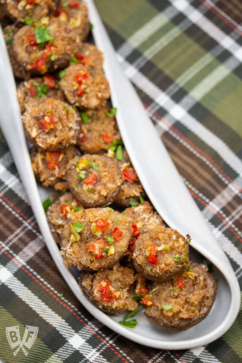 A platter full of Italian stuffed mushroom caps.