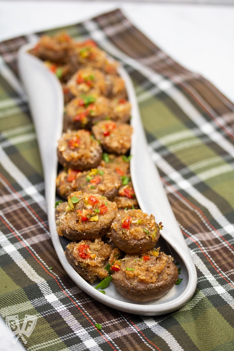 A platter full of Italian stuffed mushroom caps.