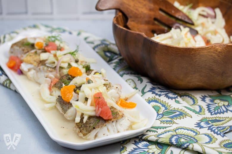 Cod topped with fresh fennel citrus salad.