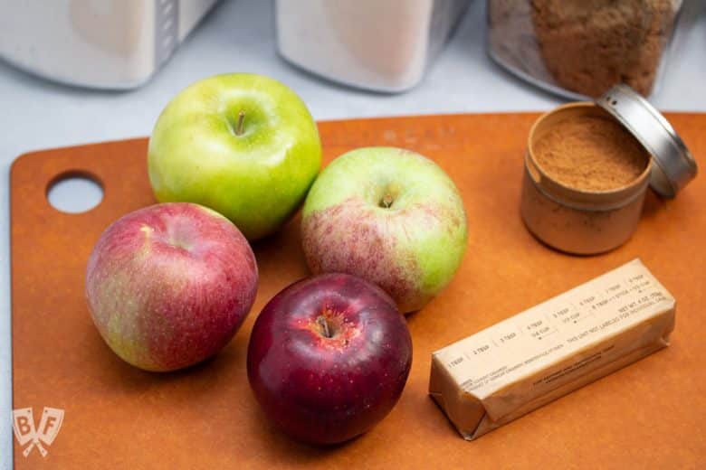 4 apples next to ingredients for baking apple pie