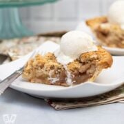Side view of a slice of Dutch apple pie a la mode