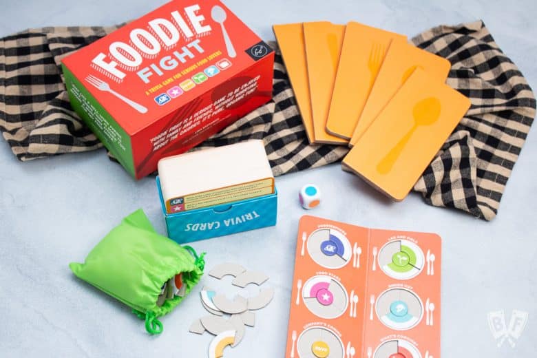 Foodie Fight trivia game with all of the game pieces shown