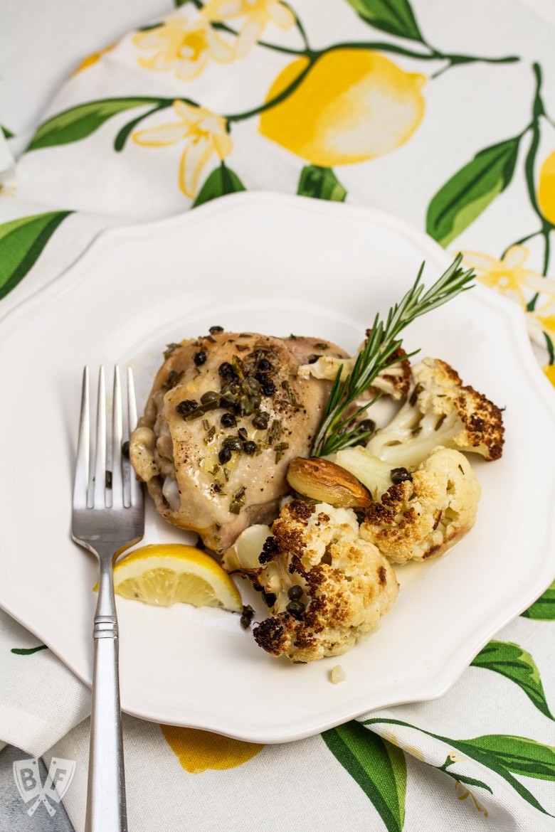 A plate of Roasted Lemon-Rosemary Chicken & Cauliflower with a fork