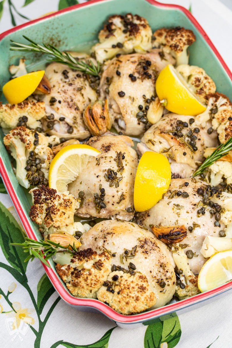 A baked tray of keto Roasted Lemon-Rosemary Chicken & Cauliflower