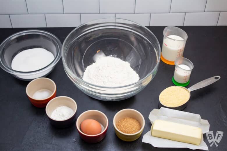 Baking ingredients laid out to make sweet corn muffins.