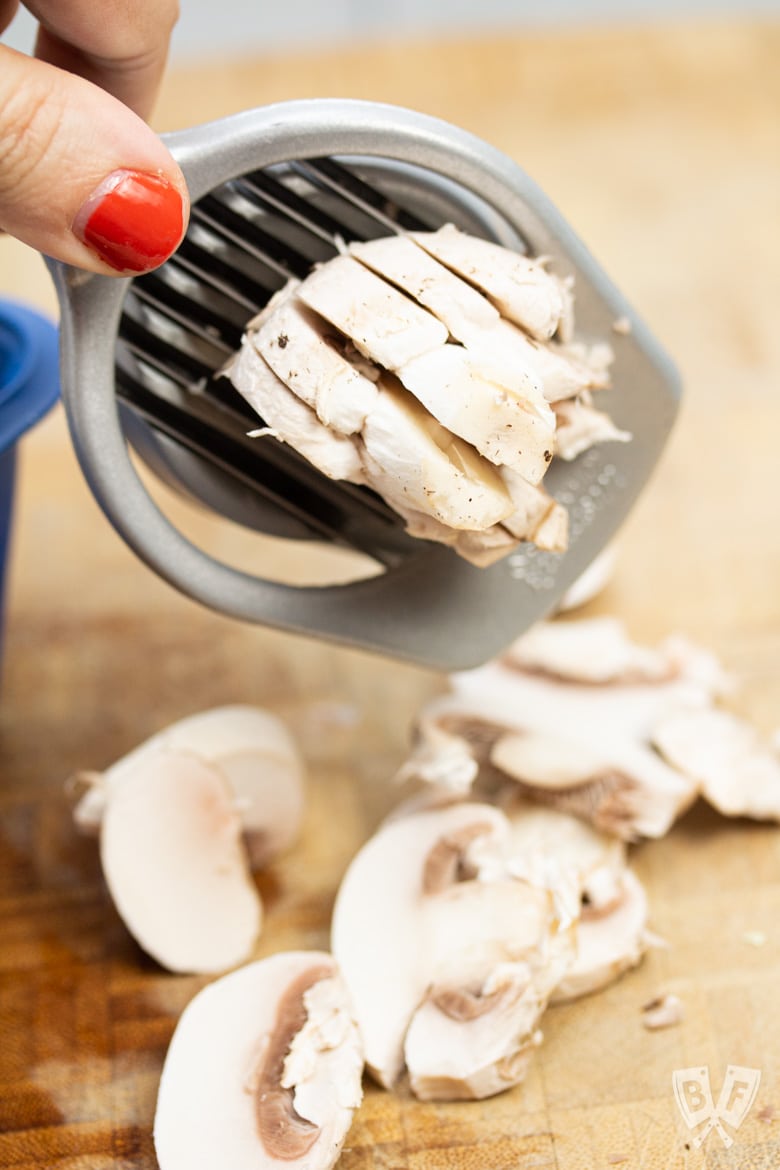 Cutting a mushroom with an egg slicer.