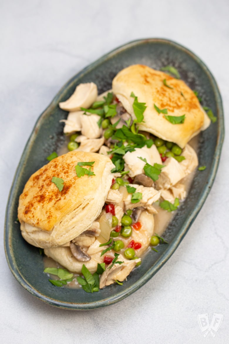 Chicken a la king served with biscuits.