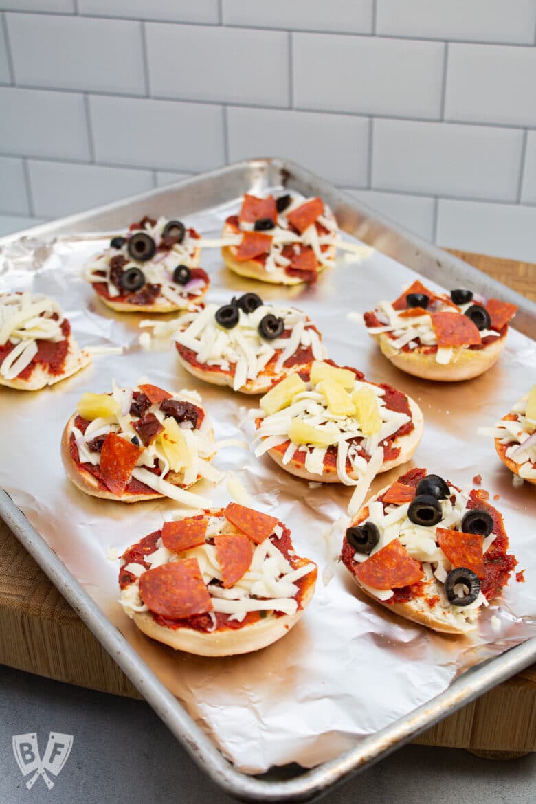 Tray of mini pizza bagels ready for the oven.