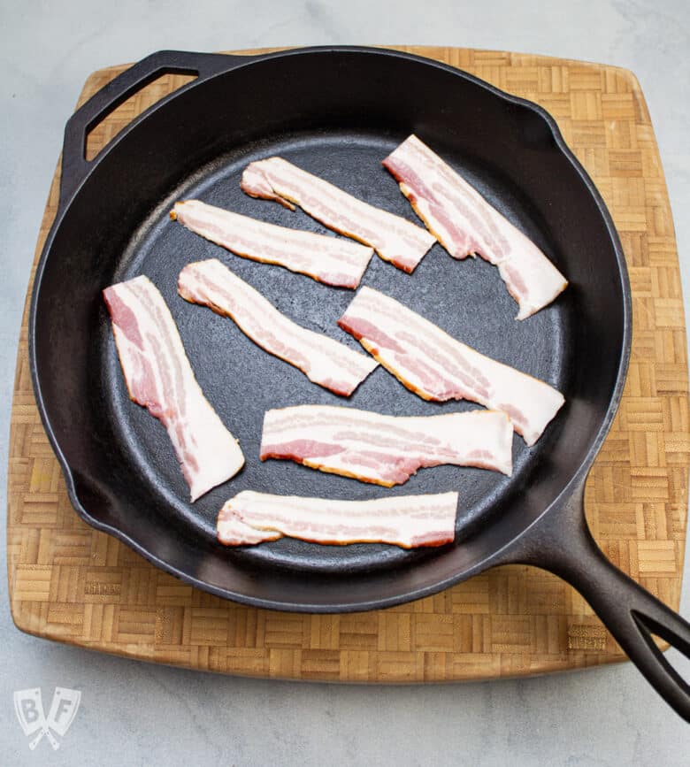 Bacon in a cast iron skillet.