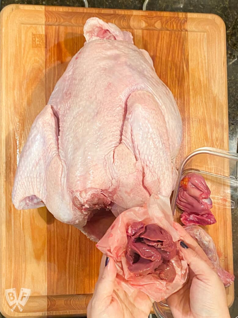 Raw turkey with giblets removed showing the liver.
