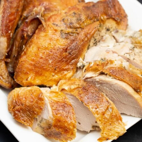 Close-up of sliced turkey breast on a platter.