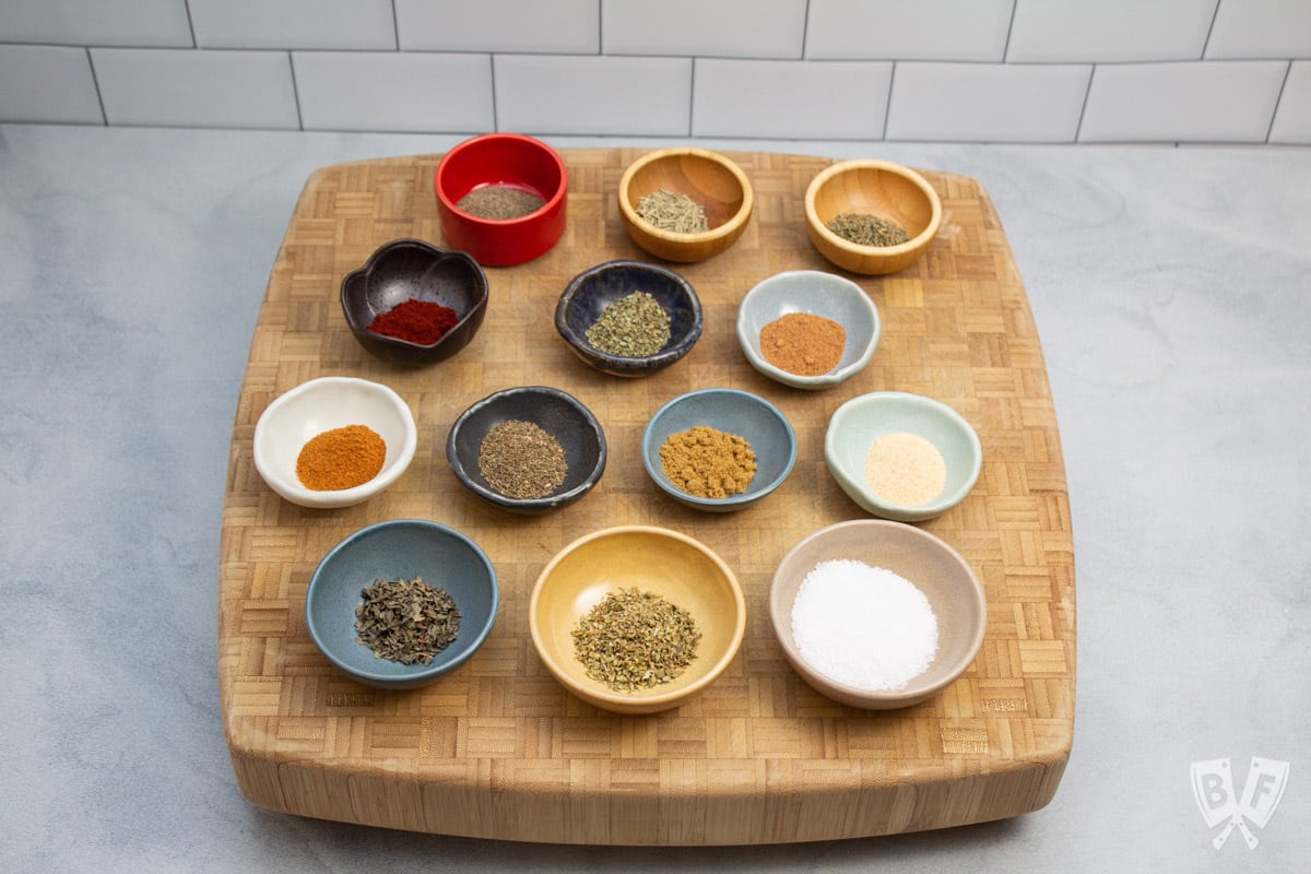 Overhead view of spices in bowls for homemade fajita seasoning.