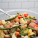 Scooping a spoonful of Calabrese potato salad from the bowl