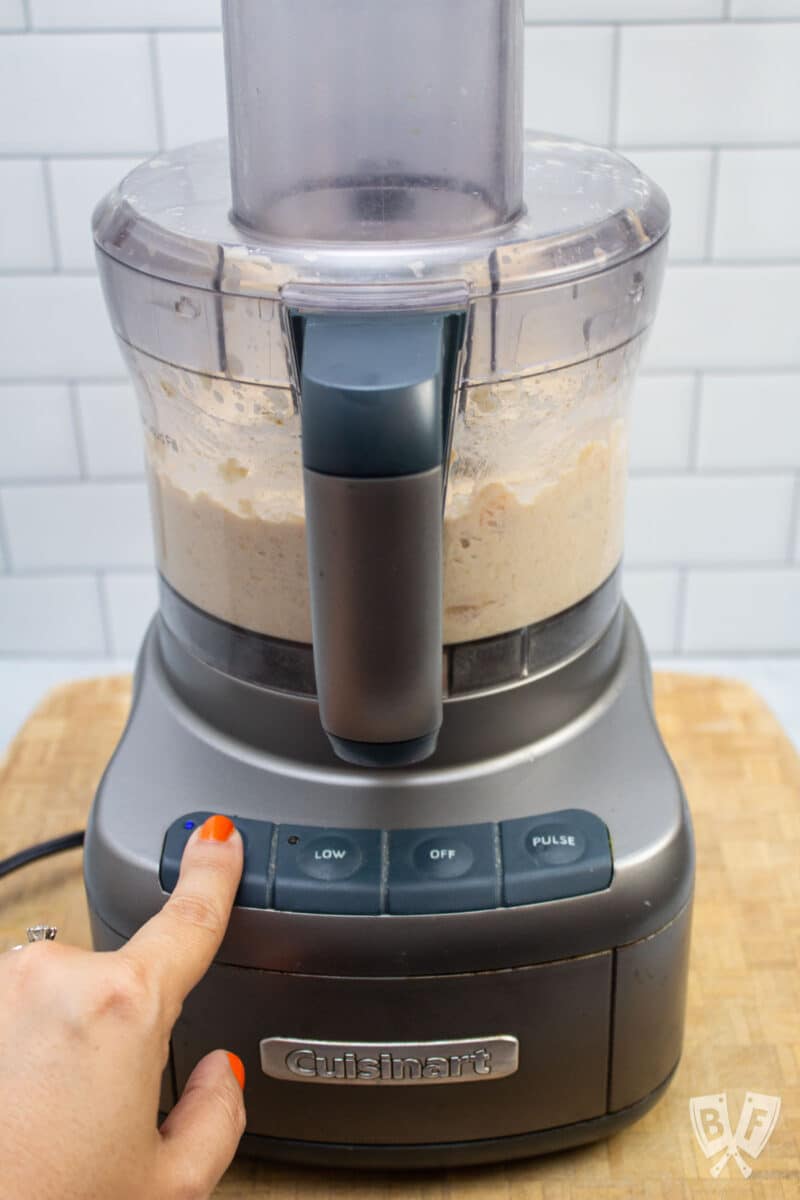 Hummus in a food processor on high speed.