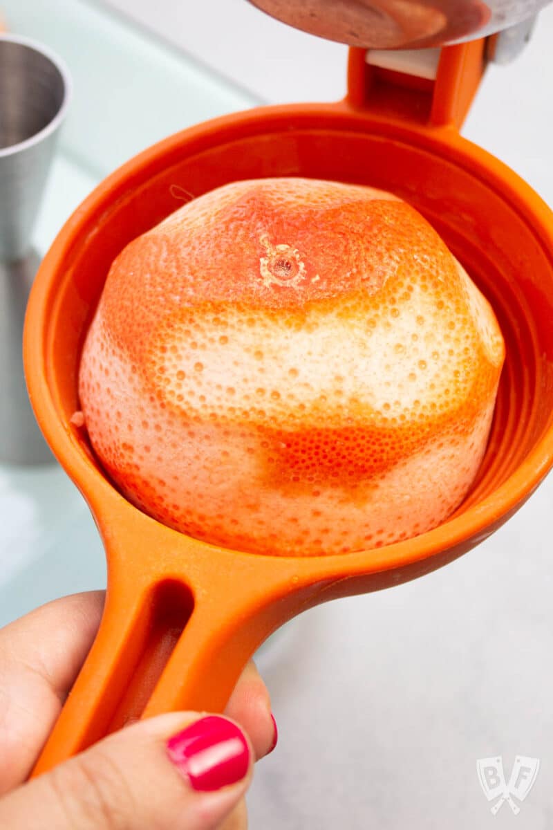 Grapefruit in a citrus juicer.