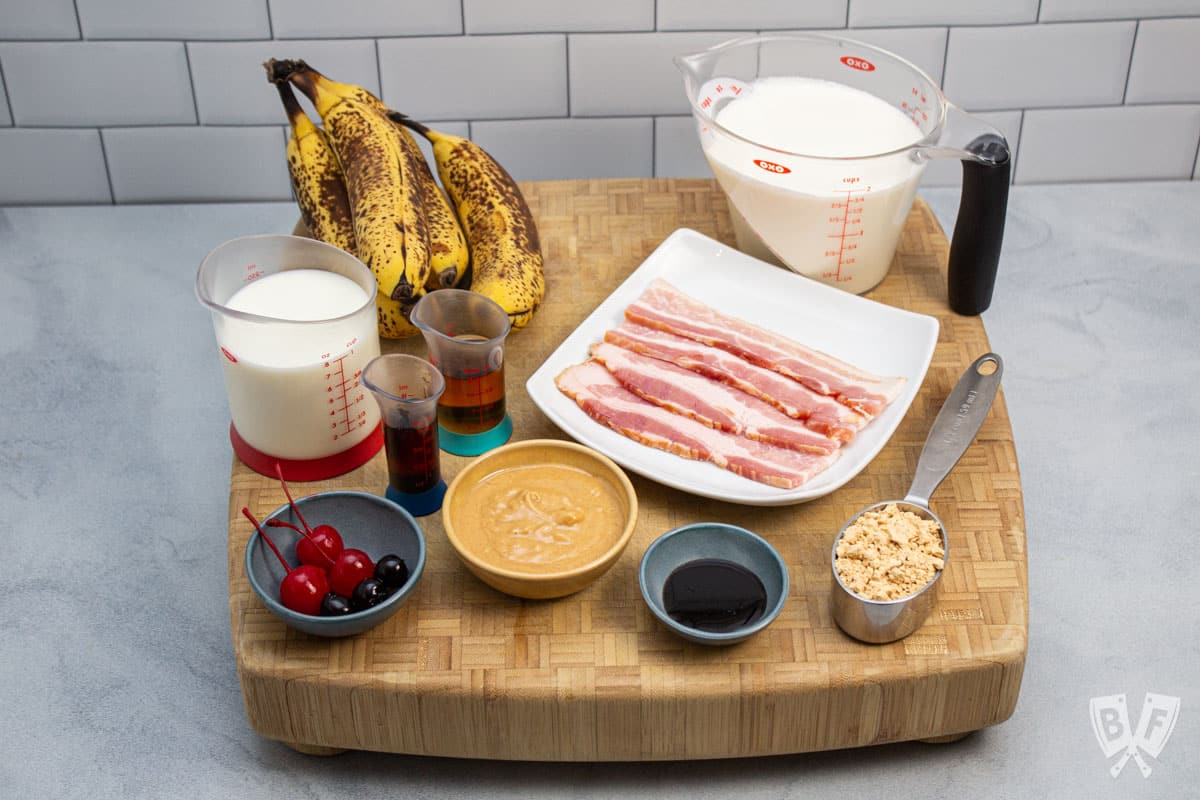 Ingredients ready to make a peanut butter banana milkshake with bacon.