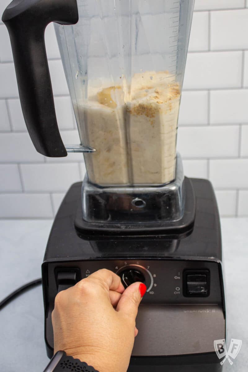 Blending a peanut butter banana milkshake.