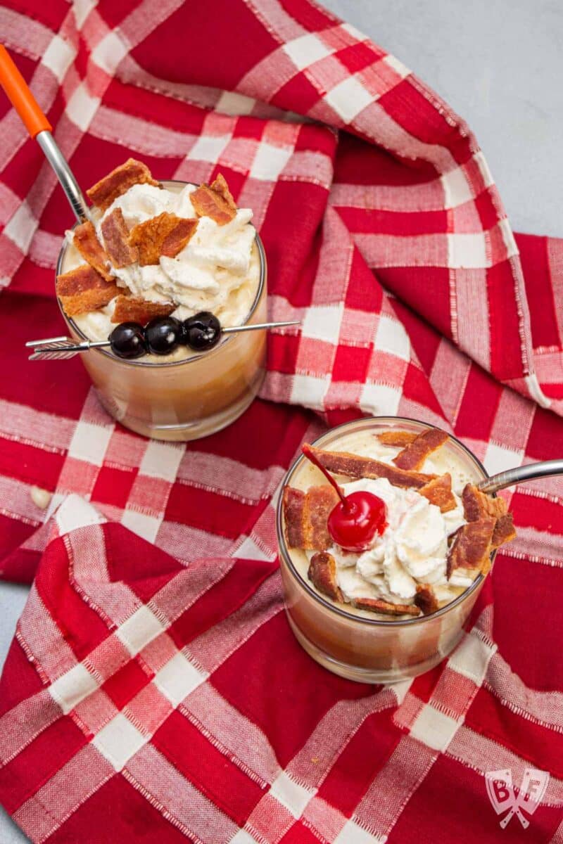 Overhead view of 2 peanut butter banana milkshakes with bacon.