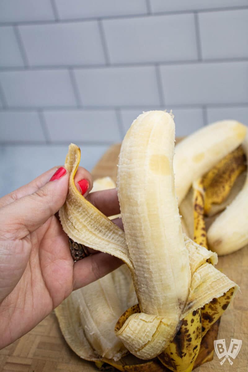 Peeling a ripe banana.