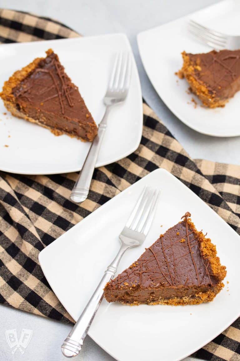 3 plates with slices of triple chocolate pumpkin pie.