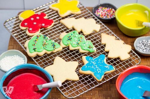 Cooling rack of decorated cut out sugar cookies.