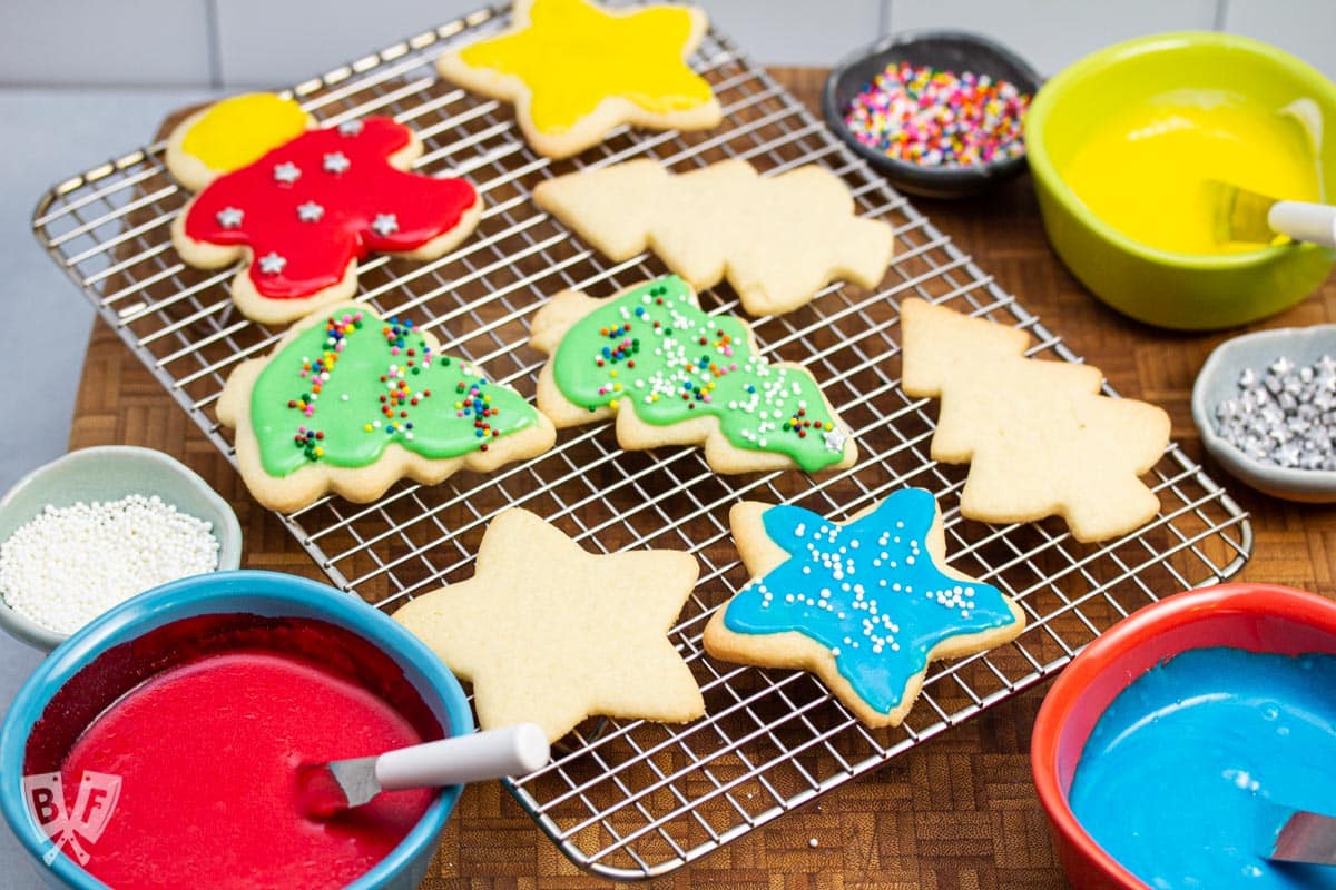 Cooling rack of decorated cut out sugar cookies.