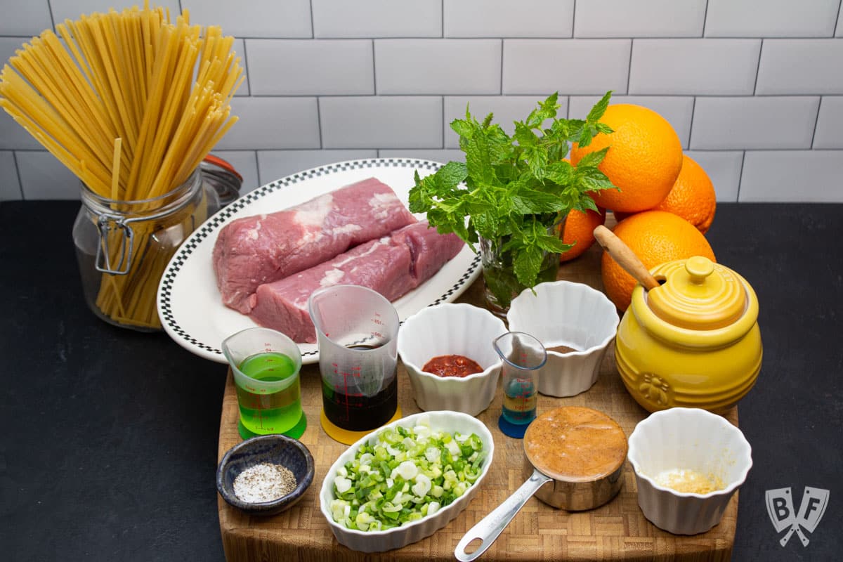 Ingredients laid out to make peanut noodles with pork tenderloin and honeyed oranges.