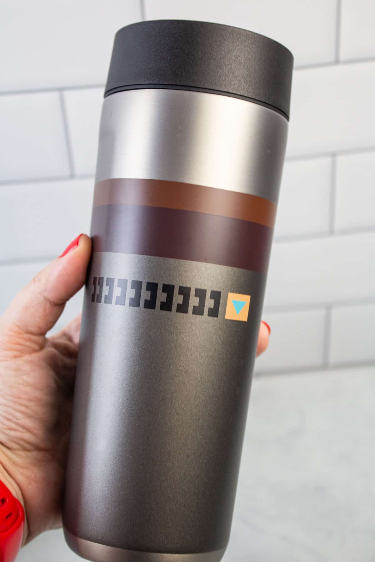 Mandolorian themed insulated travel coffee cup.