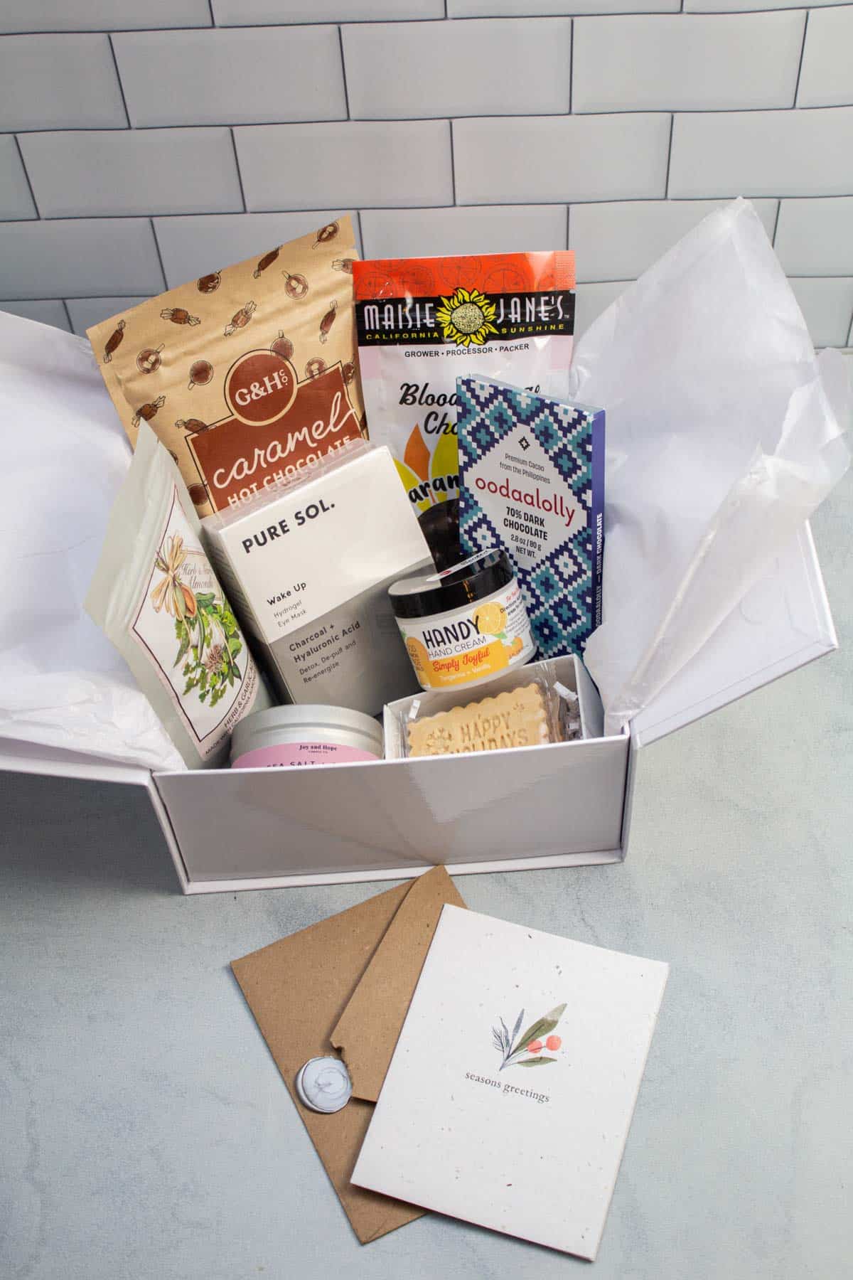 Gift box full of assorted food and self-care items.