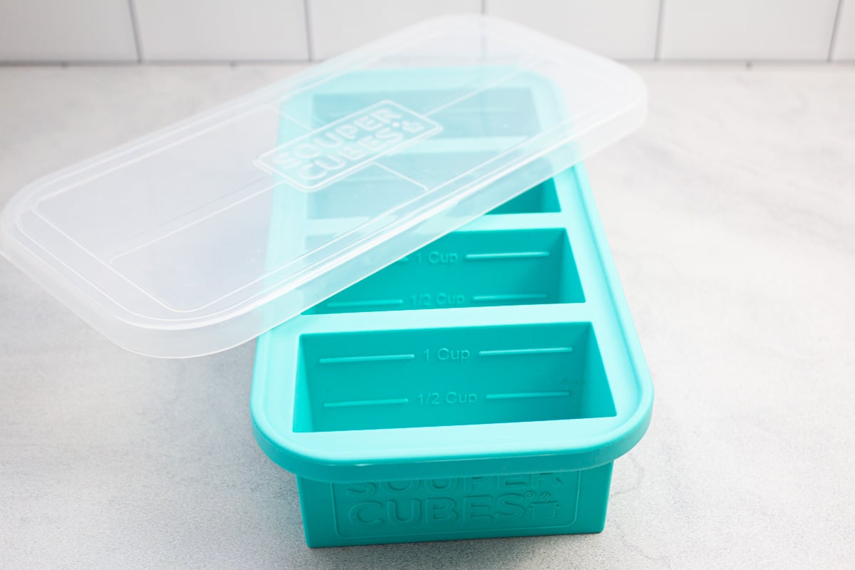 Portioned silicone freezer tray with lid.