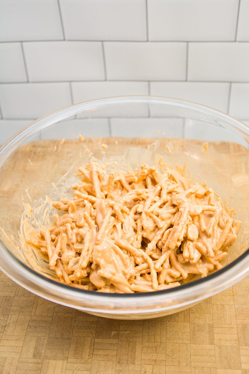 A bowl of no-bake butterscotch haystack mix, ready to shape.