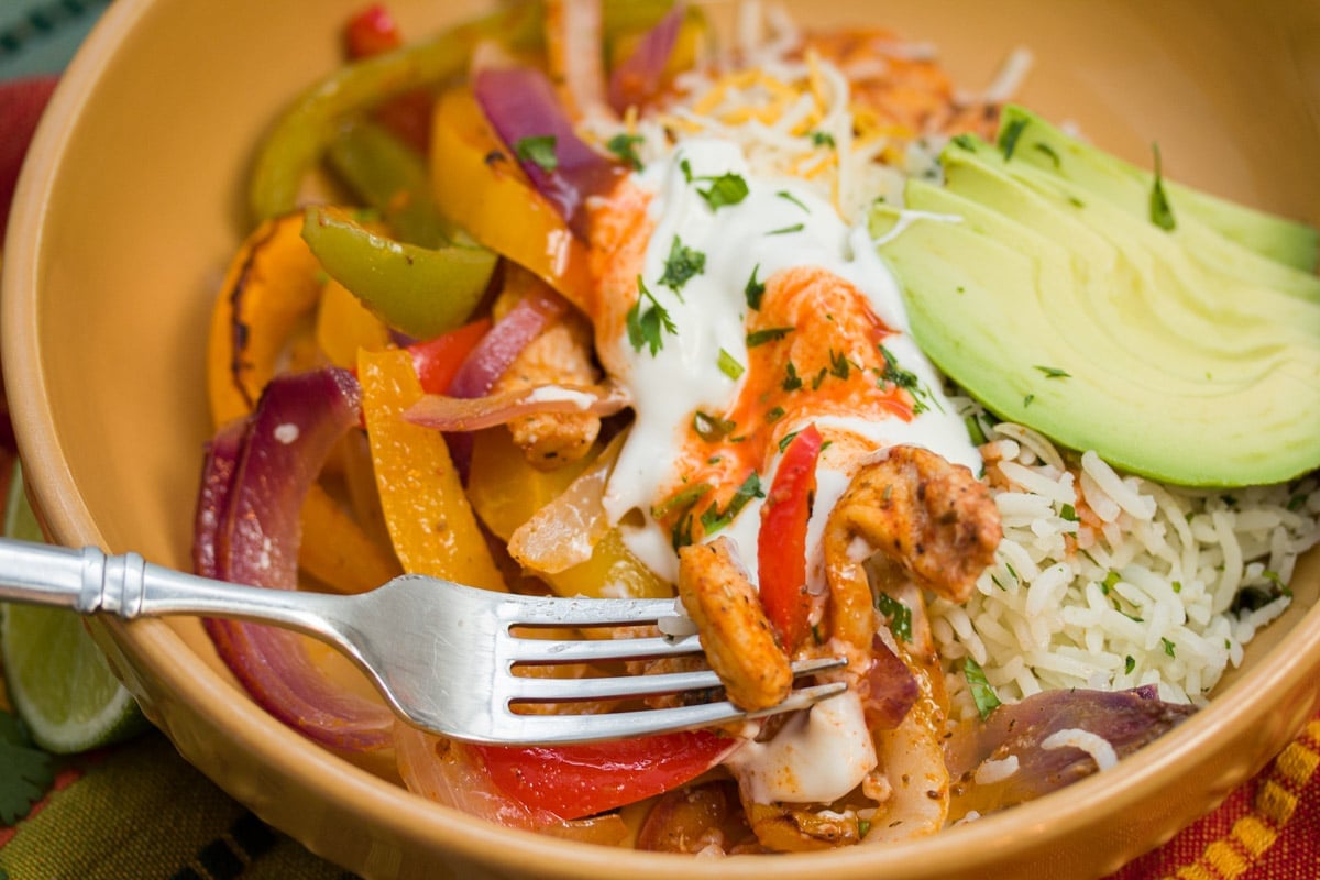 Forkful of chicken fajita mixture.