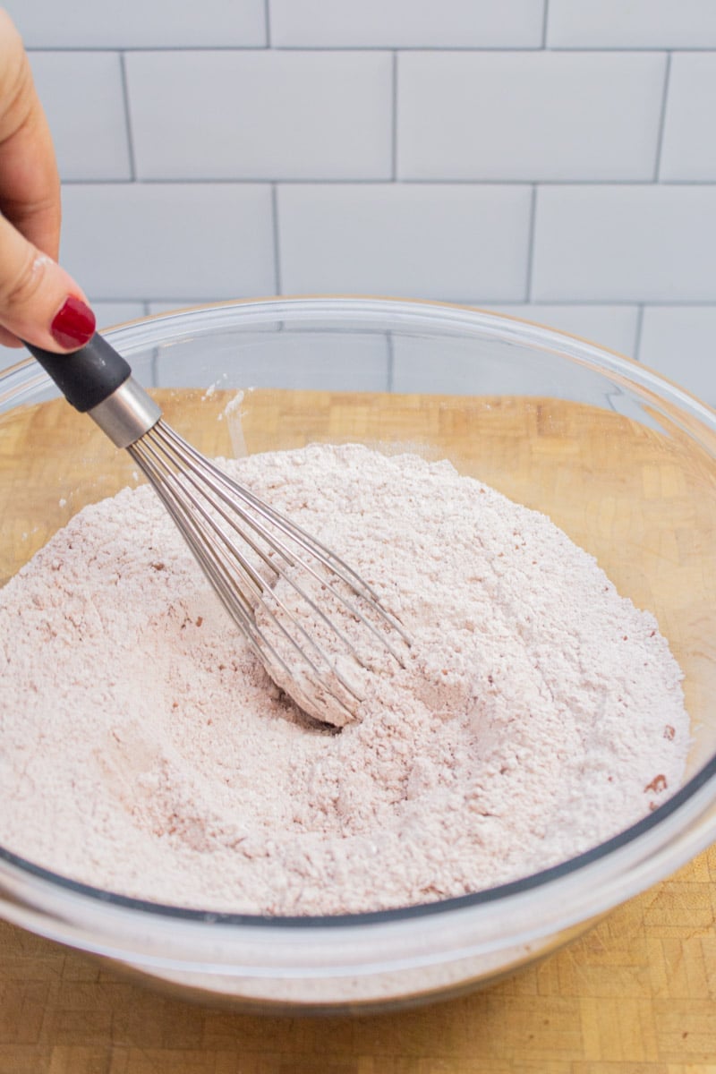 Whisking together dry ingredients for chocolate chocolate chip pancakes.