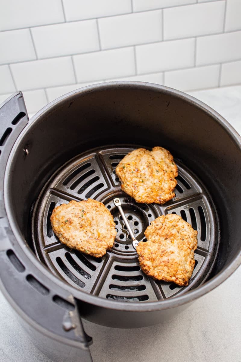 Turkey sausage patties in an air fryer.