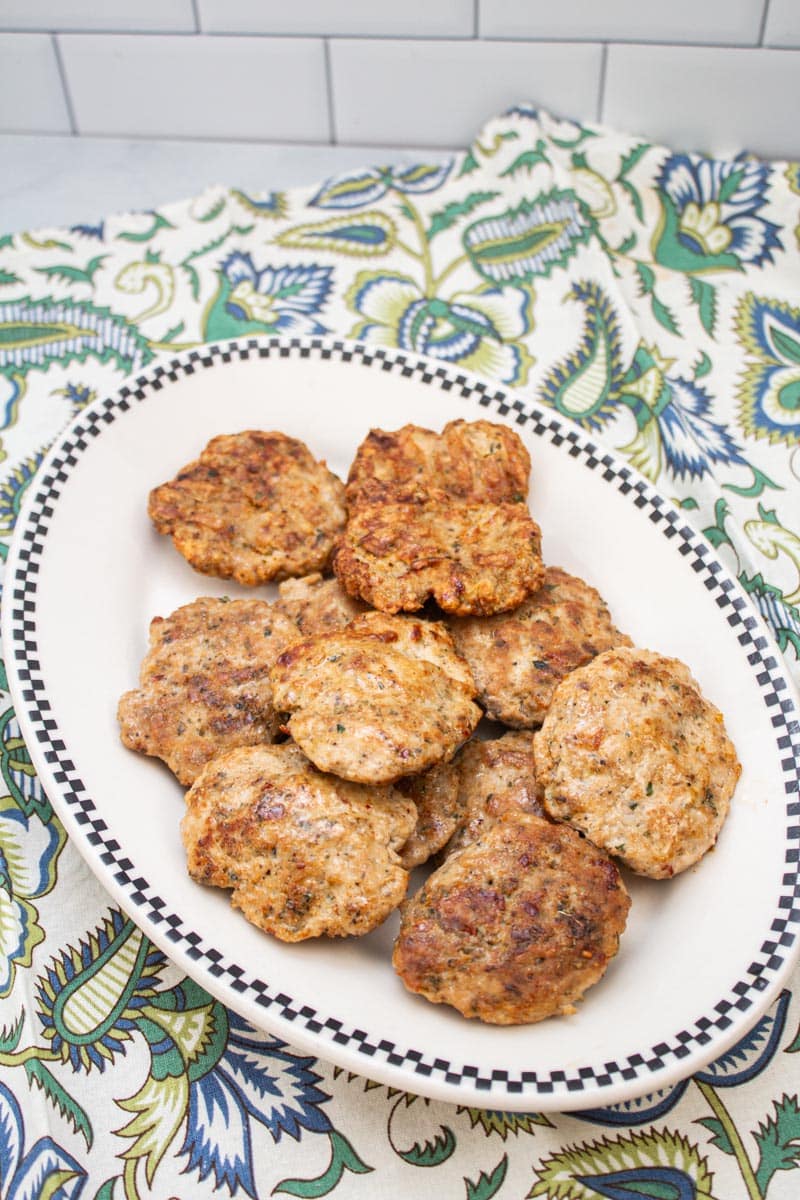 Turkey sausage patties and a jar of breakfast sausage seasoning.