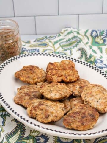 Turkey sausage patties and a jar of breakfast sausage seasoning.