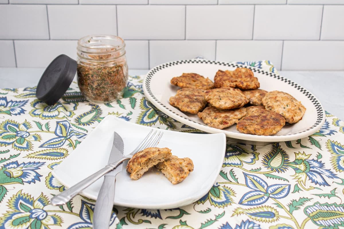 Turkey sausage patties and a jar of breakfast sausage seasoning.