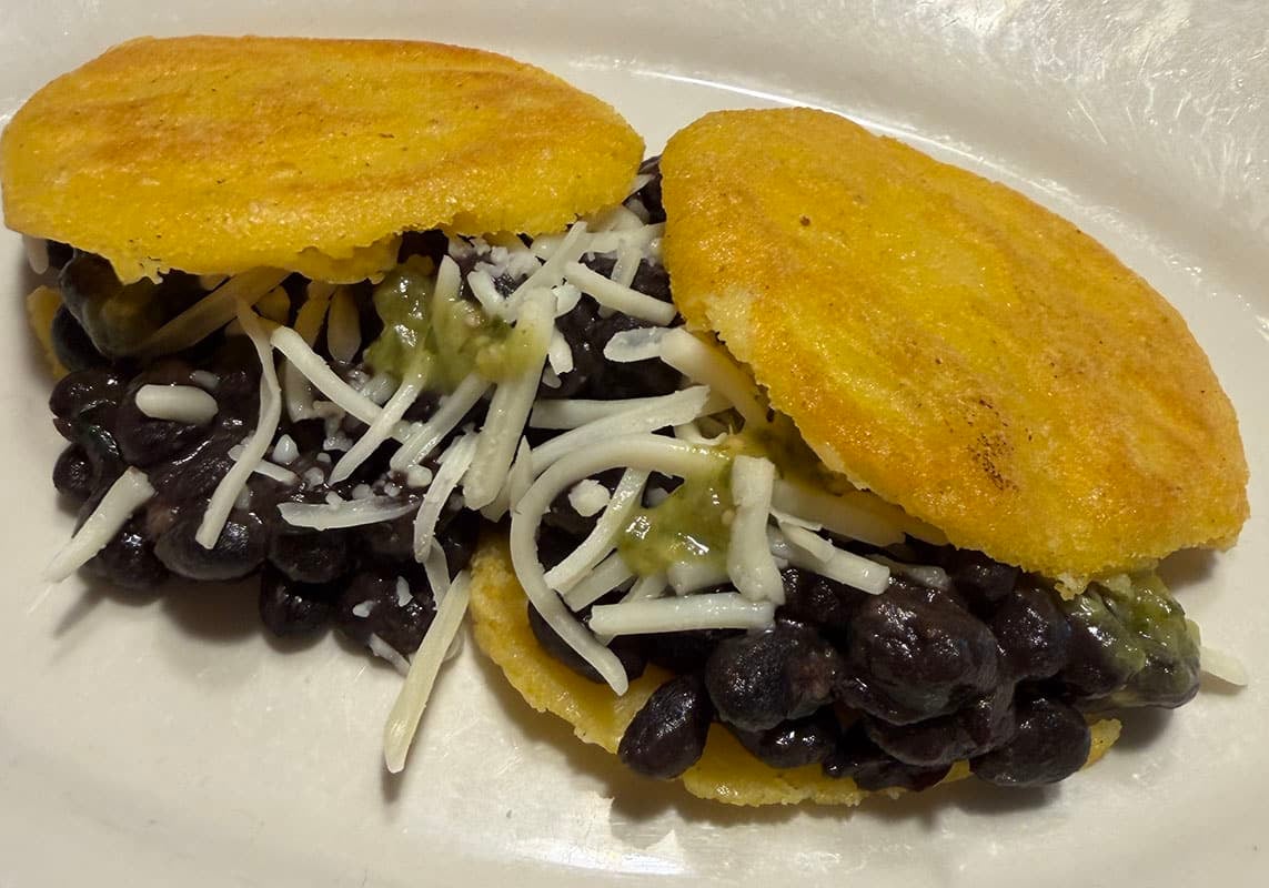 Arepas filled with black beans and cheese.
